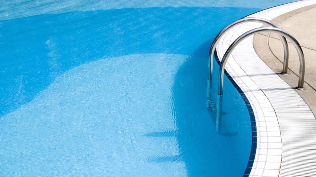 Green pool being restored to crystal clear water